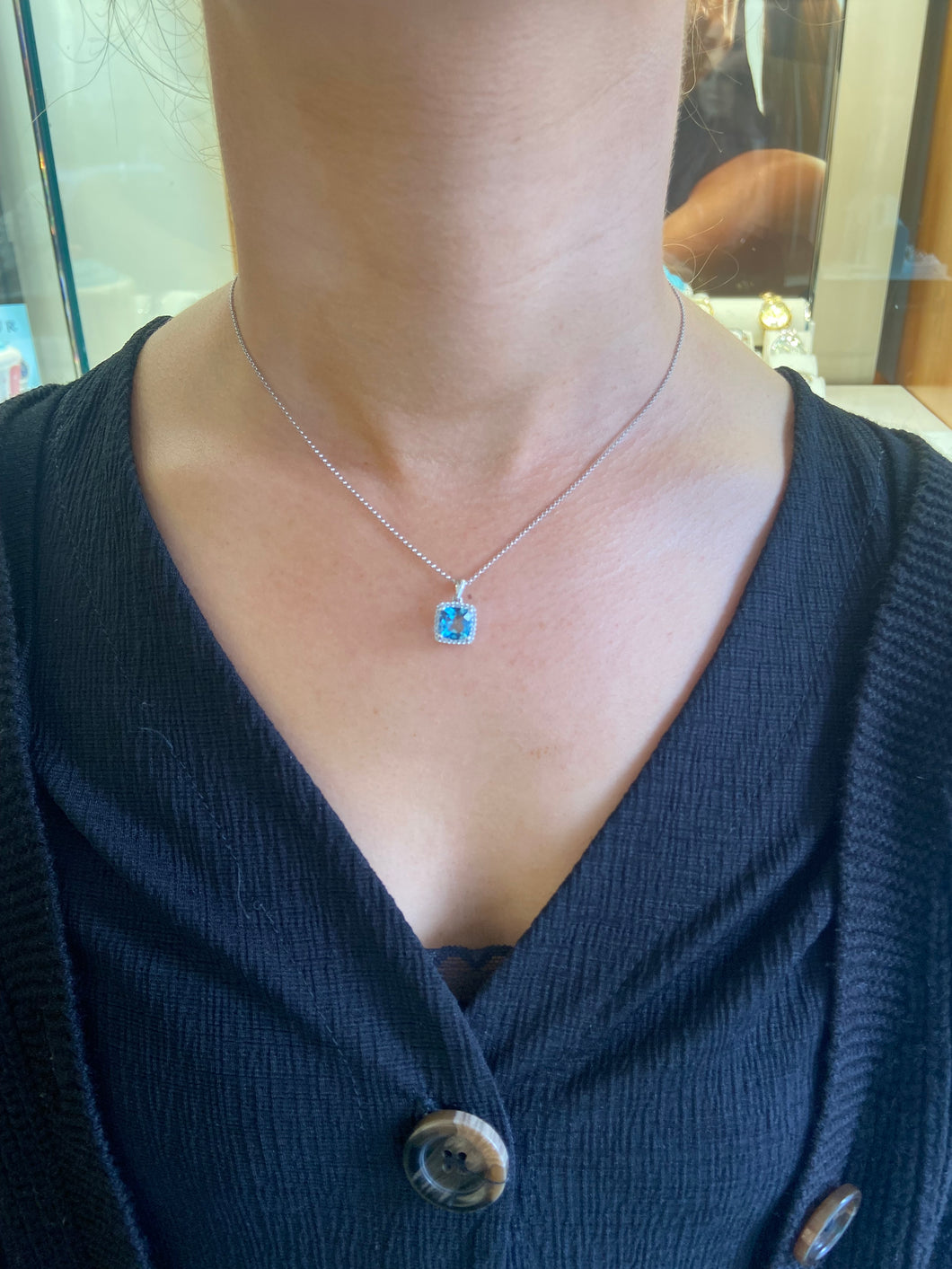 18ct white gold blue Topaz and diamond pendant