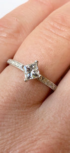 18CT WHITE GOLD PRINCESS CUT SOLITAIRE RING WITH DIAMOND SET SHOULDERS